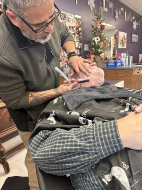 Hot towel straight razor shave in progress
